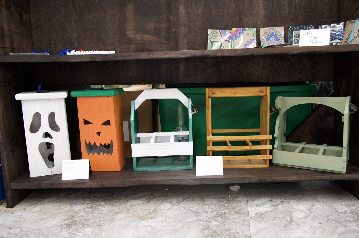 Hand-painted wooden lanterns and beer and wine bottle carriers