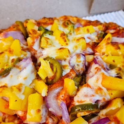 Pizza with pineapple, jalapeno and red onion