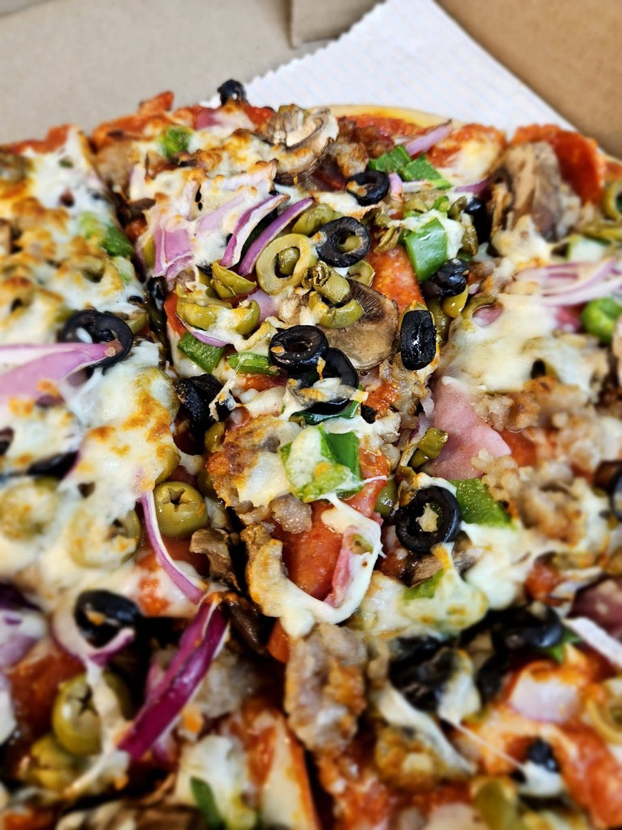 Loaded specialty pizza with olives, onions, mushrooms and peppers