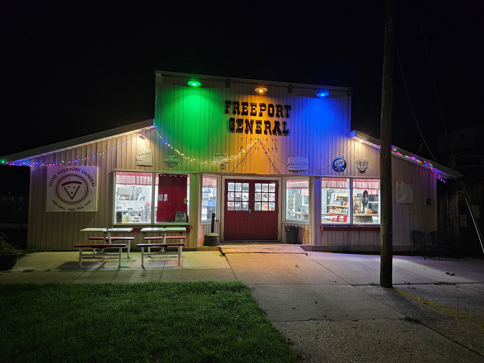 Heinz Freeport General storefront lit up at night